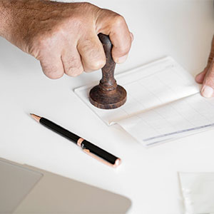 man stamping a document